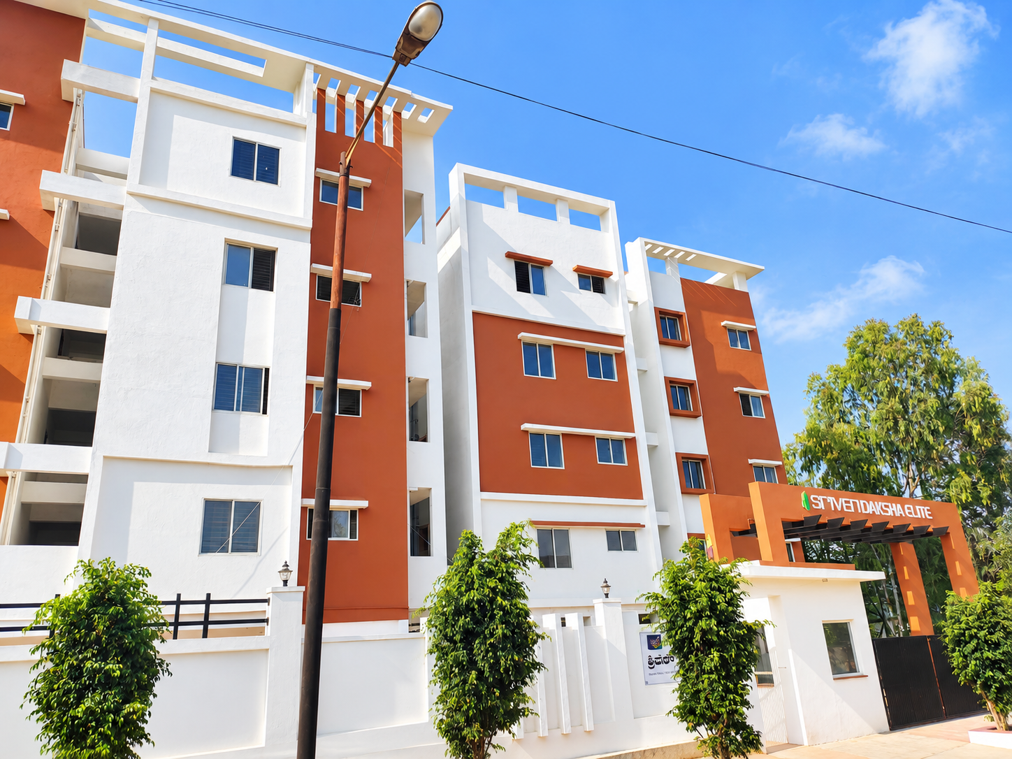 Road side view of apartment blocks at Infenity Sriven Daksha Elite at Bommasandra